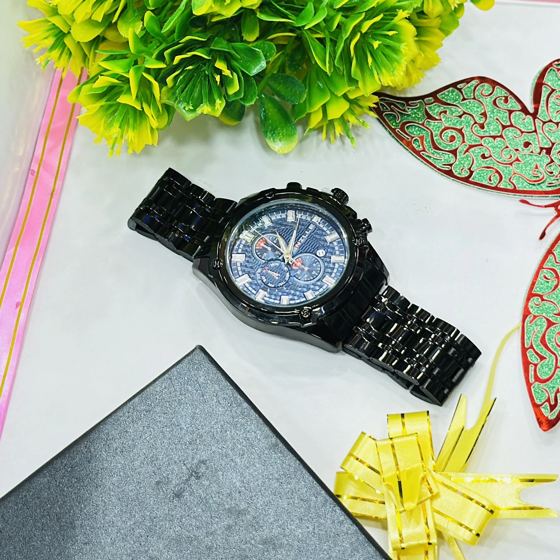 Black metal analog chronograph wristwatch