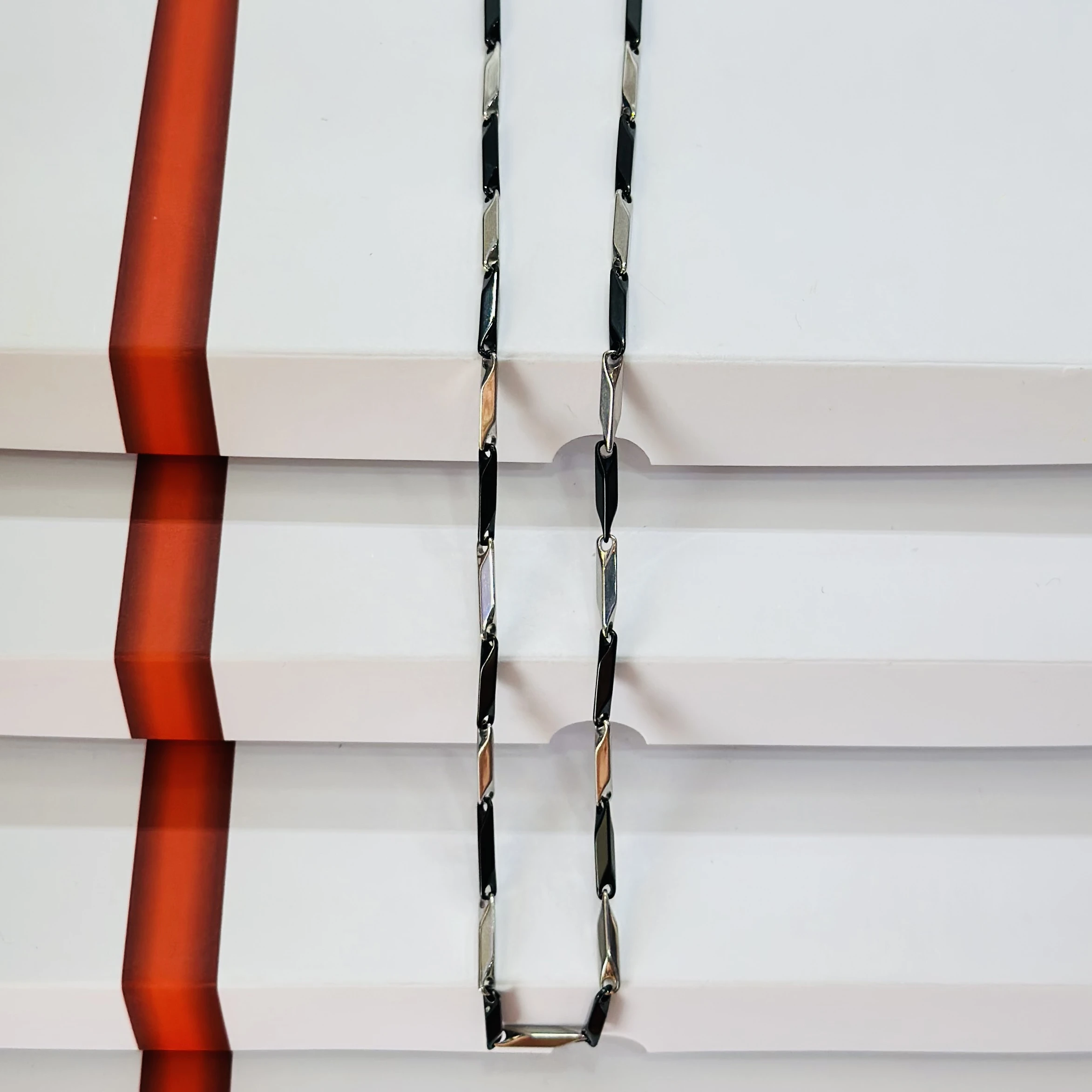 Silver toned metal curb chain