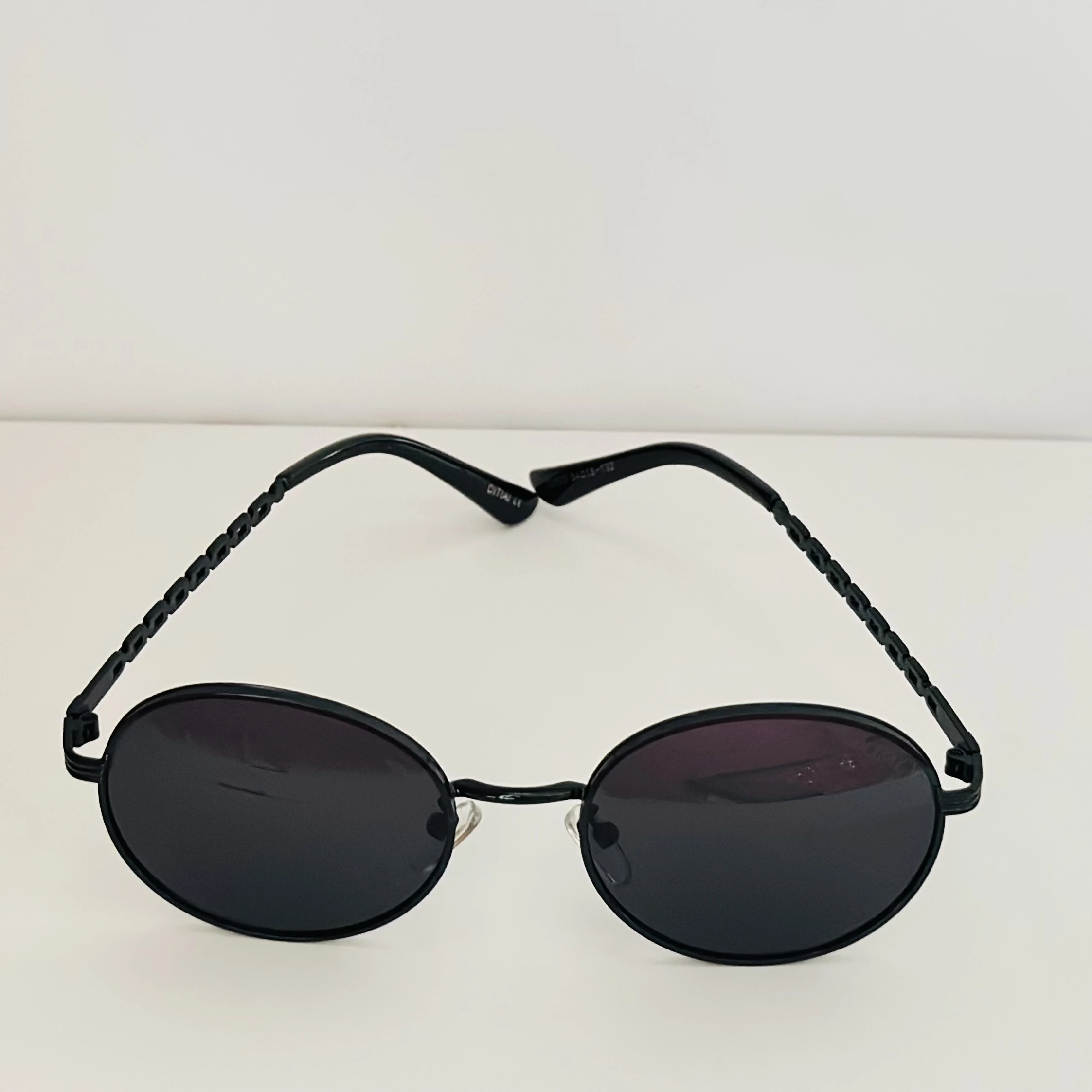 Moncler Tatou ML 0224 sunglasses in black metal with round lenses.