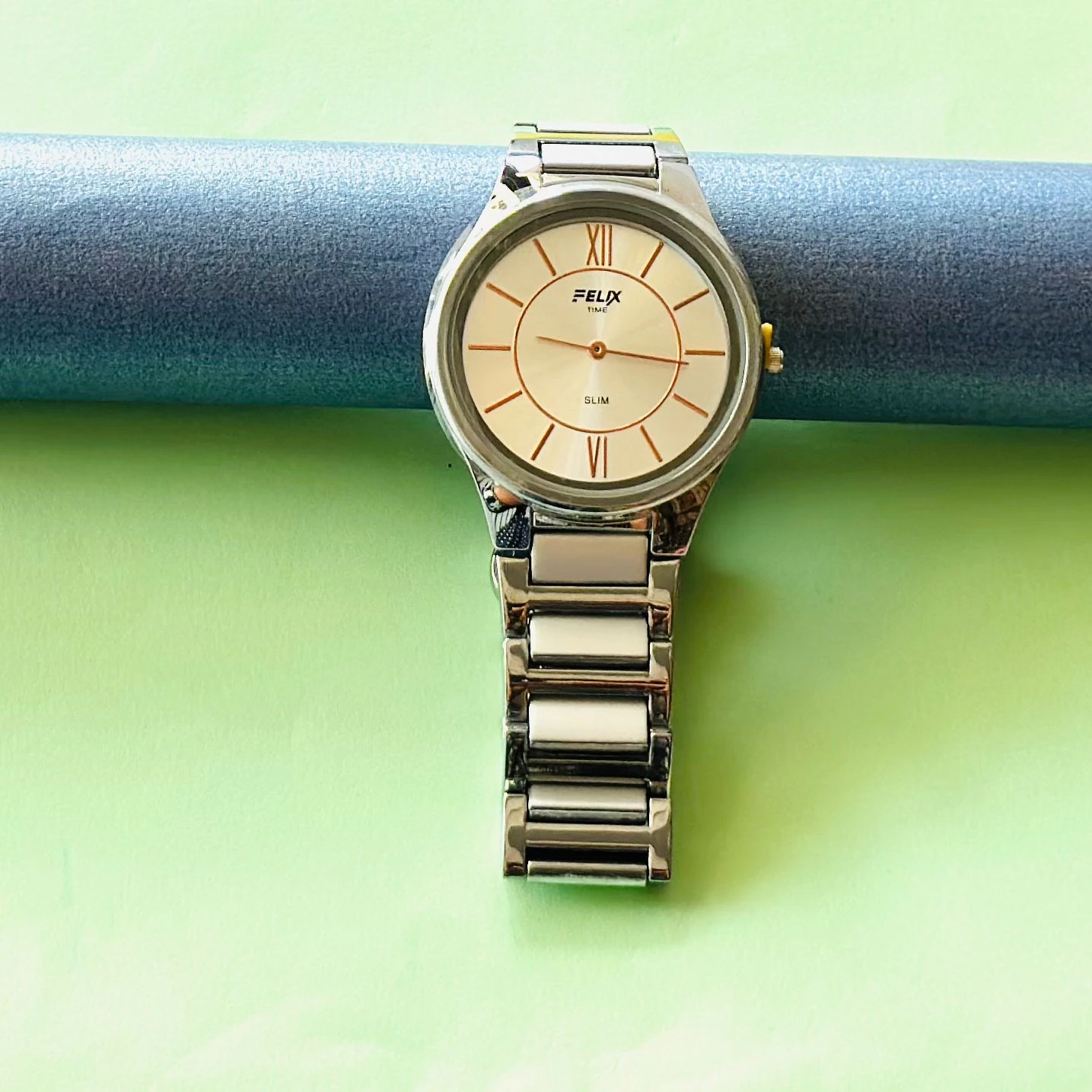 Felix Time slim stainless steel analog watch.