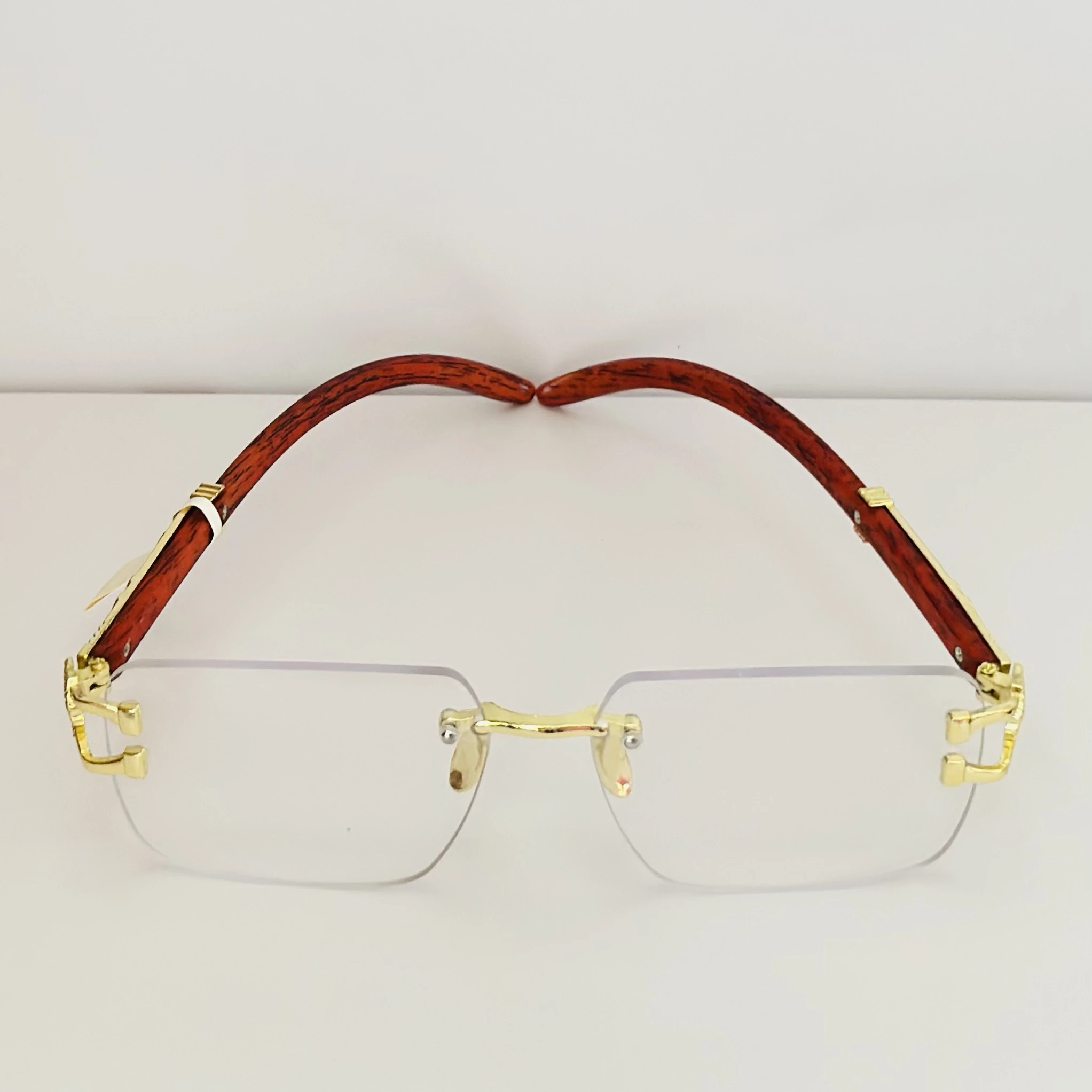 Street Knitted men's rimless gold frame glasses with clear lenses and a woodgrain finish on the arms.
