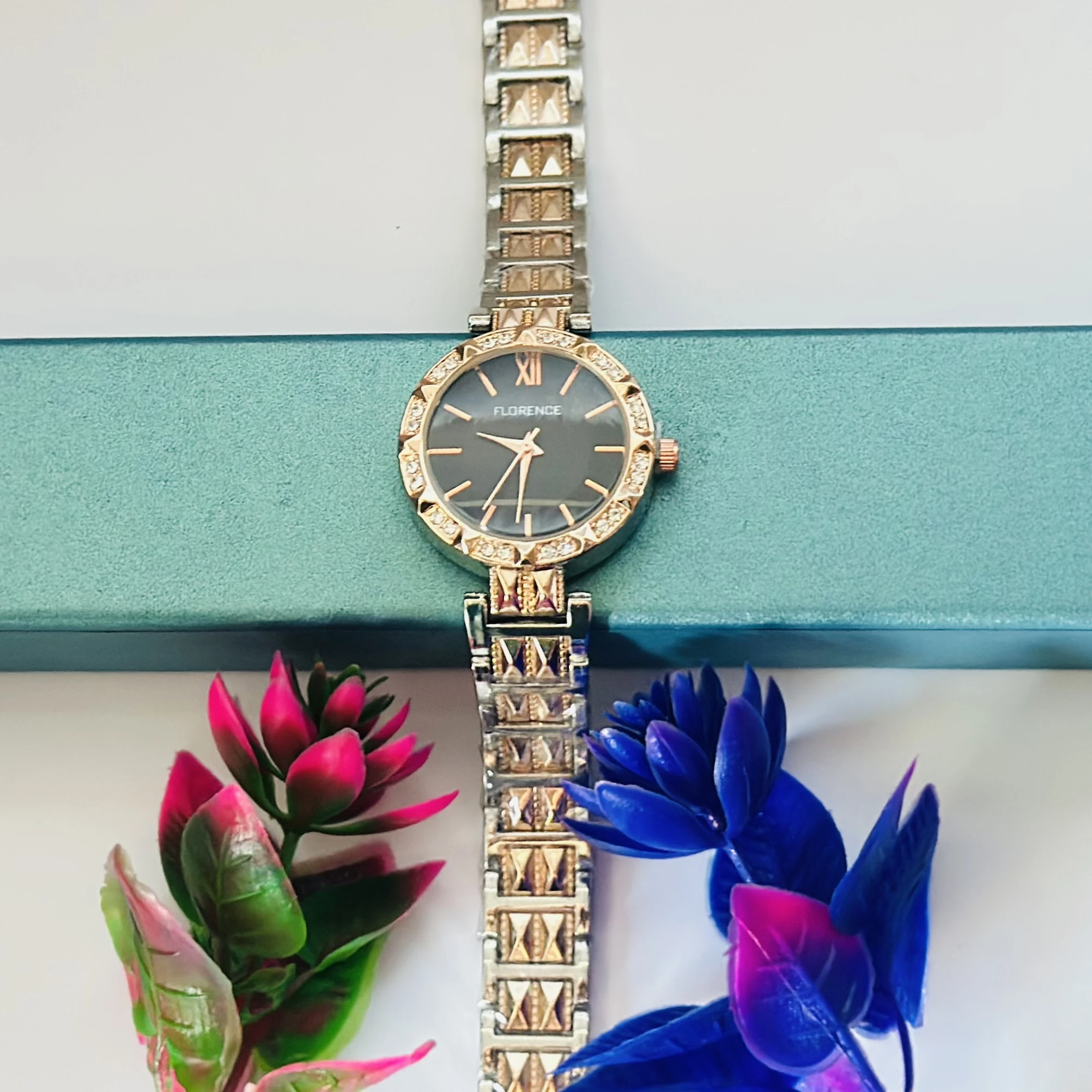 women's analog watch with a two-tone (silver and rose gold) metal strap