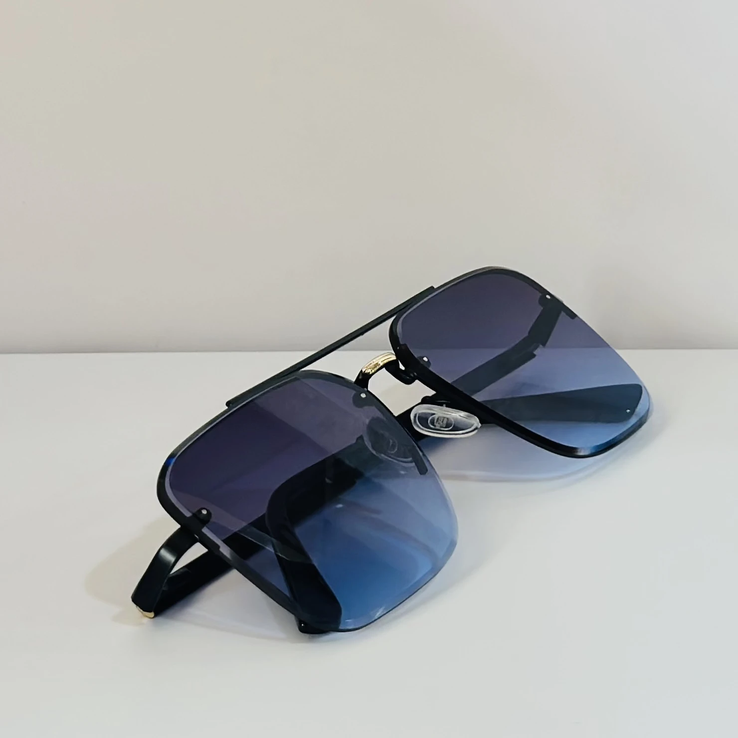 pair of Grey Jack Retro Square or Iron Man Square sunglasses with blue and grey lenses and a black frame.