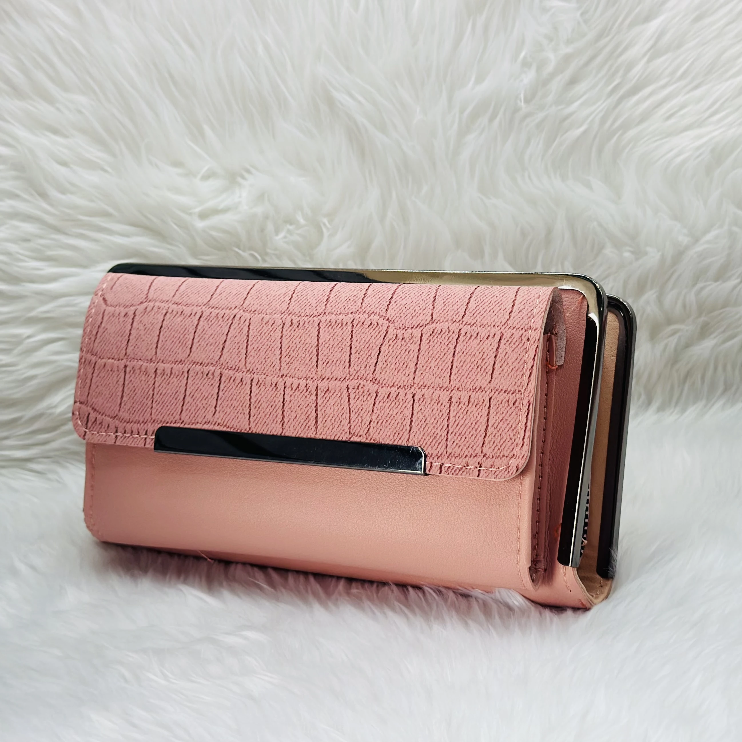 Brisfine pink clutch wallet in polyurethane outer material.