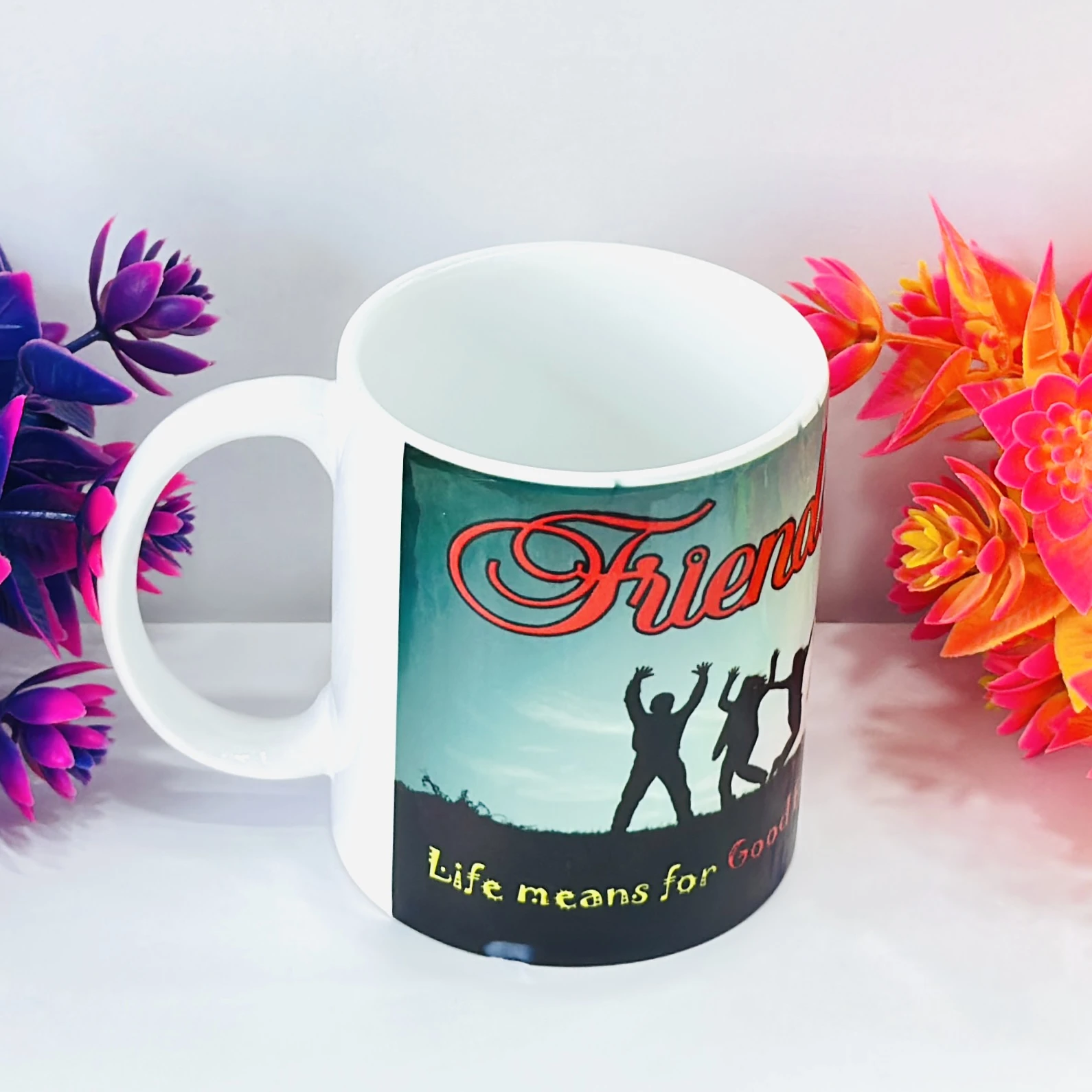 white ceramic coffee mug with a "Friends" theme design. ……XMKT8L