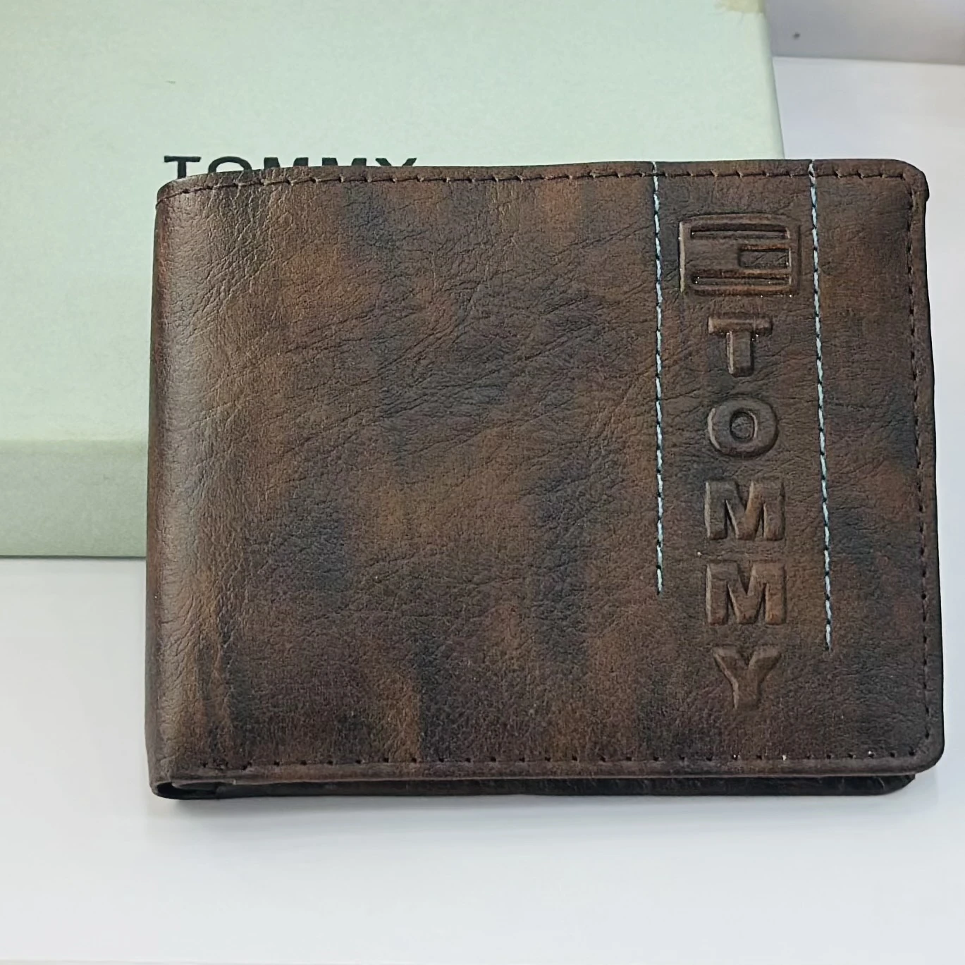 Brown bifold wallet from the brand Tommy.