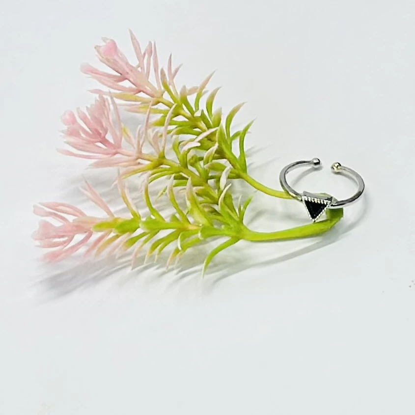 an adjustable 925 sterling silver ring with a black onyx triangle gemstone.