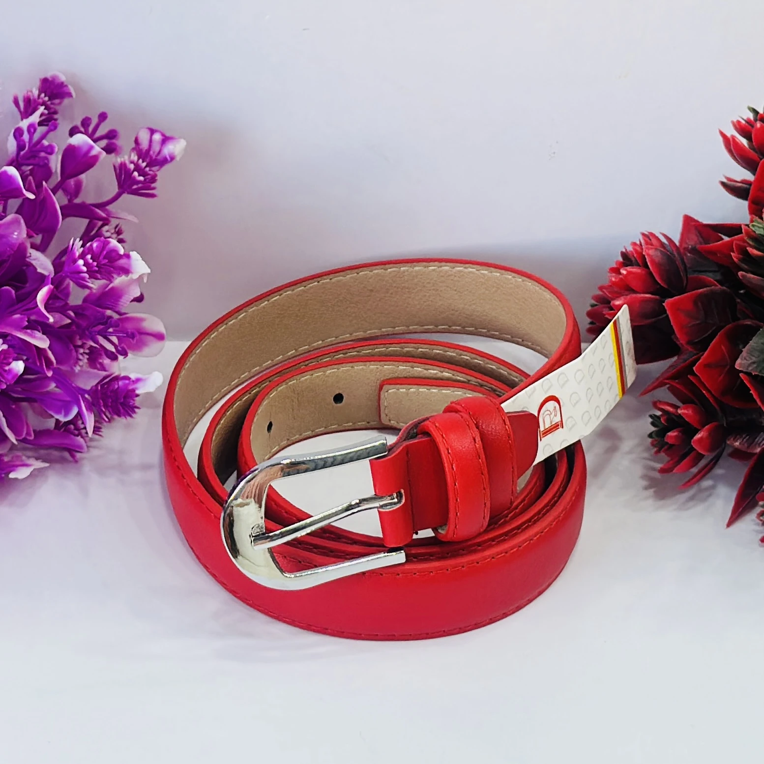 Red leather or polyurethane women's dress belt