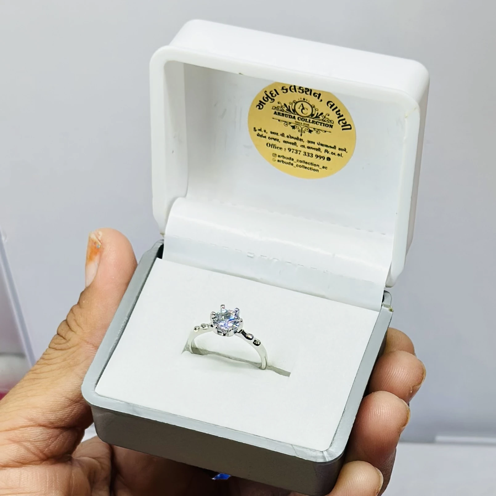 Silver solitaire engagement ring with American diamonds.