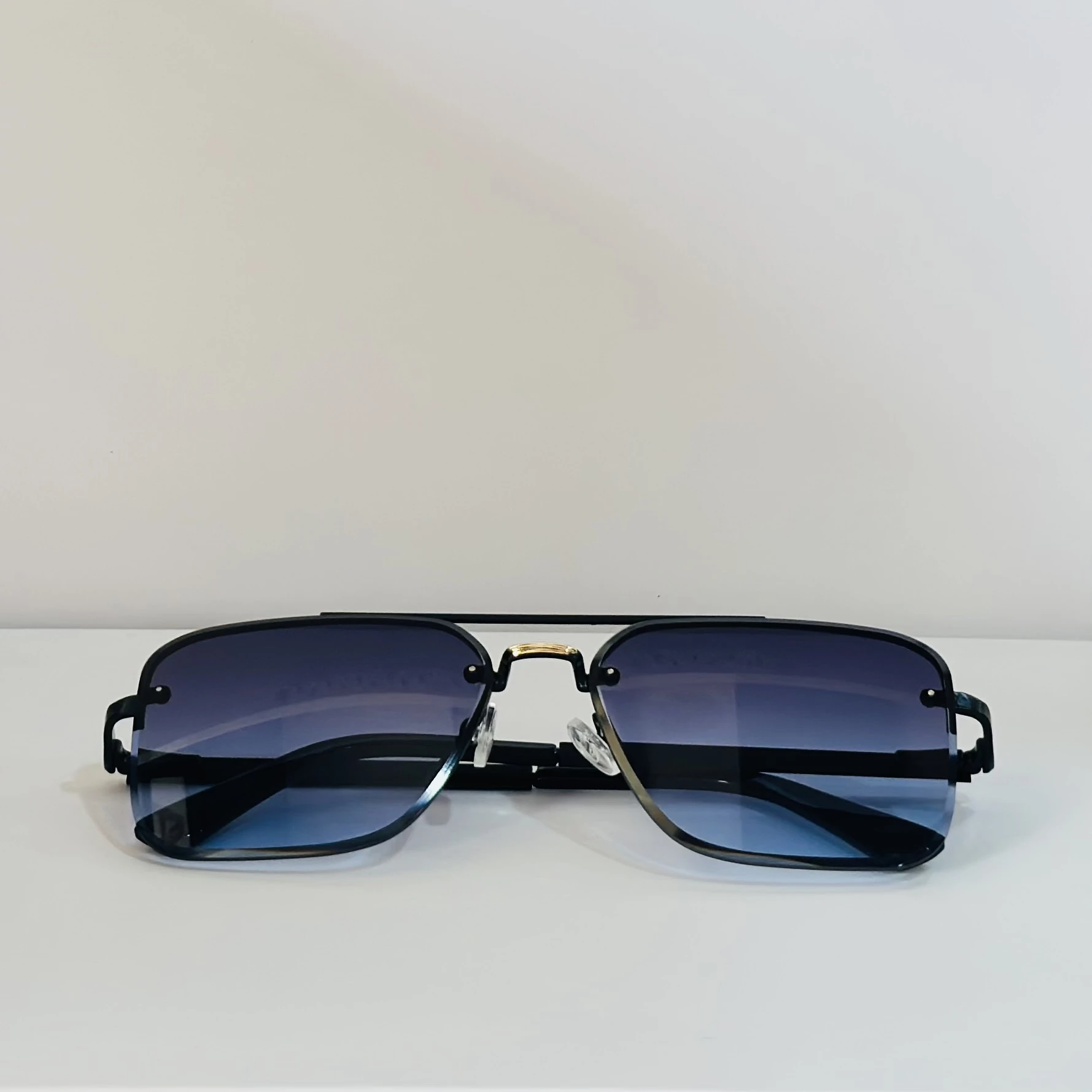 pair of Grey Jack Retro Square or Iron Man Square sunglasses with blue and grey lenses and a black frame.