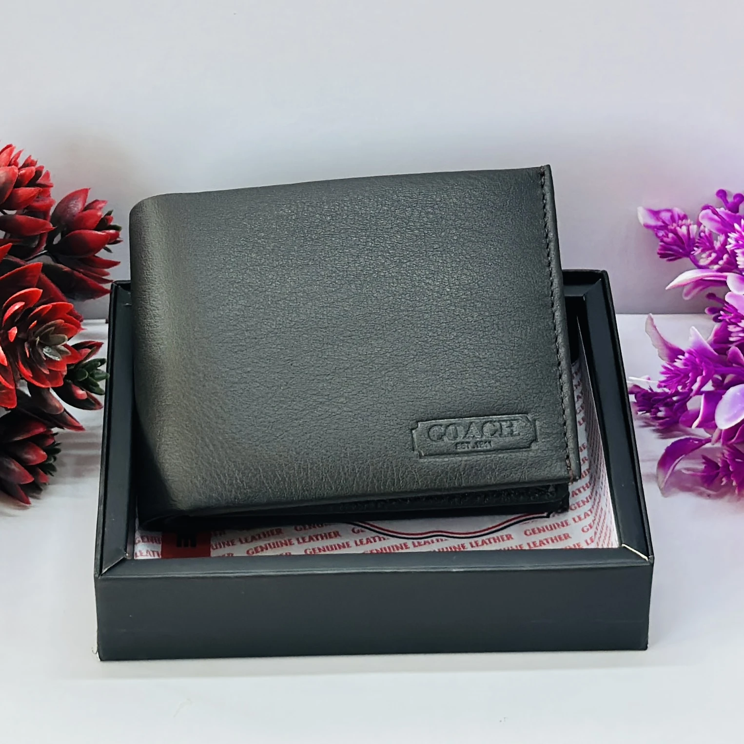 Coach men's black leather slim bifold wallet.