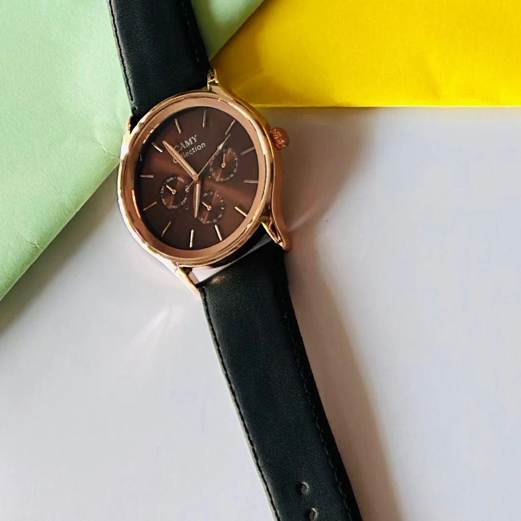 Round  analog watch with a black  leather strap