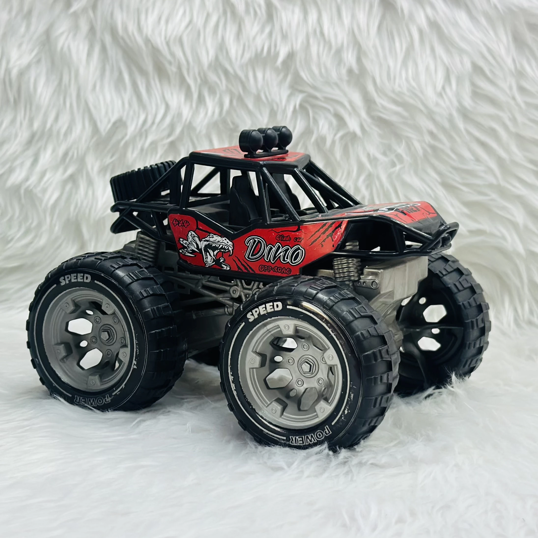 Red "Dino Off-Road" toy monster truck