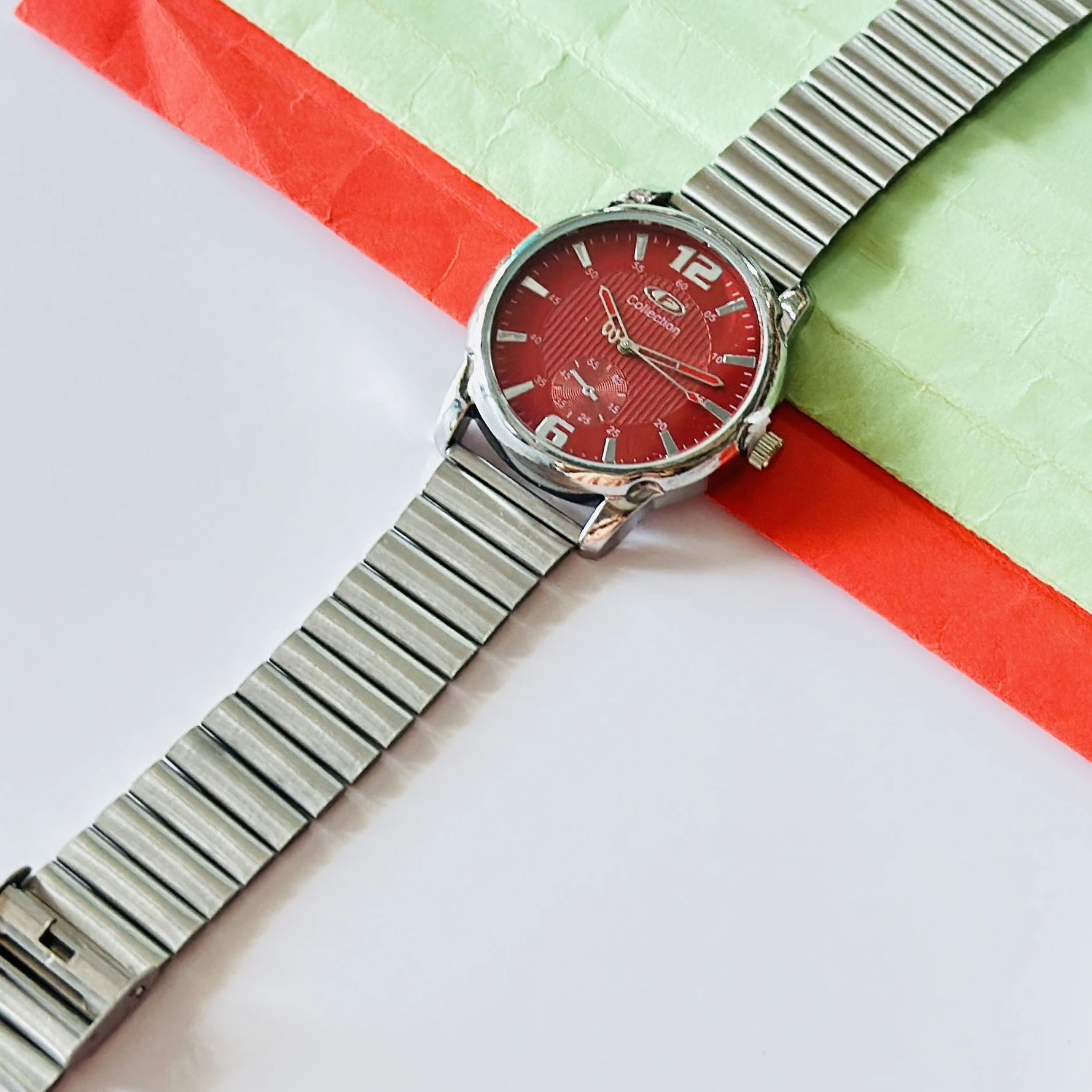 Red dial analog watch