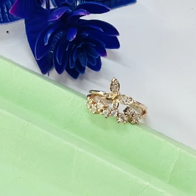 Gold plated alloy butterfly ring with a vintage style and clear stones.
