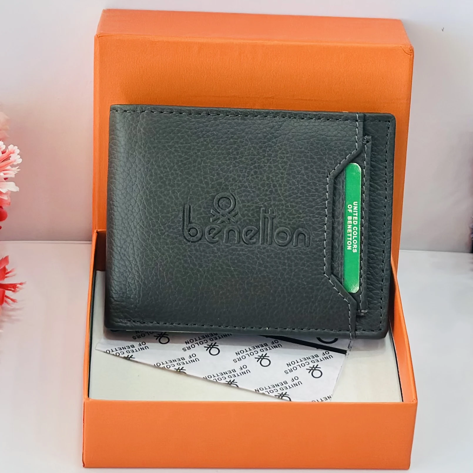Black leather bi-fold wallet from United Colors of Benetton.