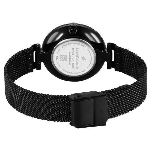 Fastrack Stunners X analog watch, featuring a striking green mother-of-pearl dial paired with a dark mesh stainless steel stra