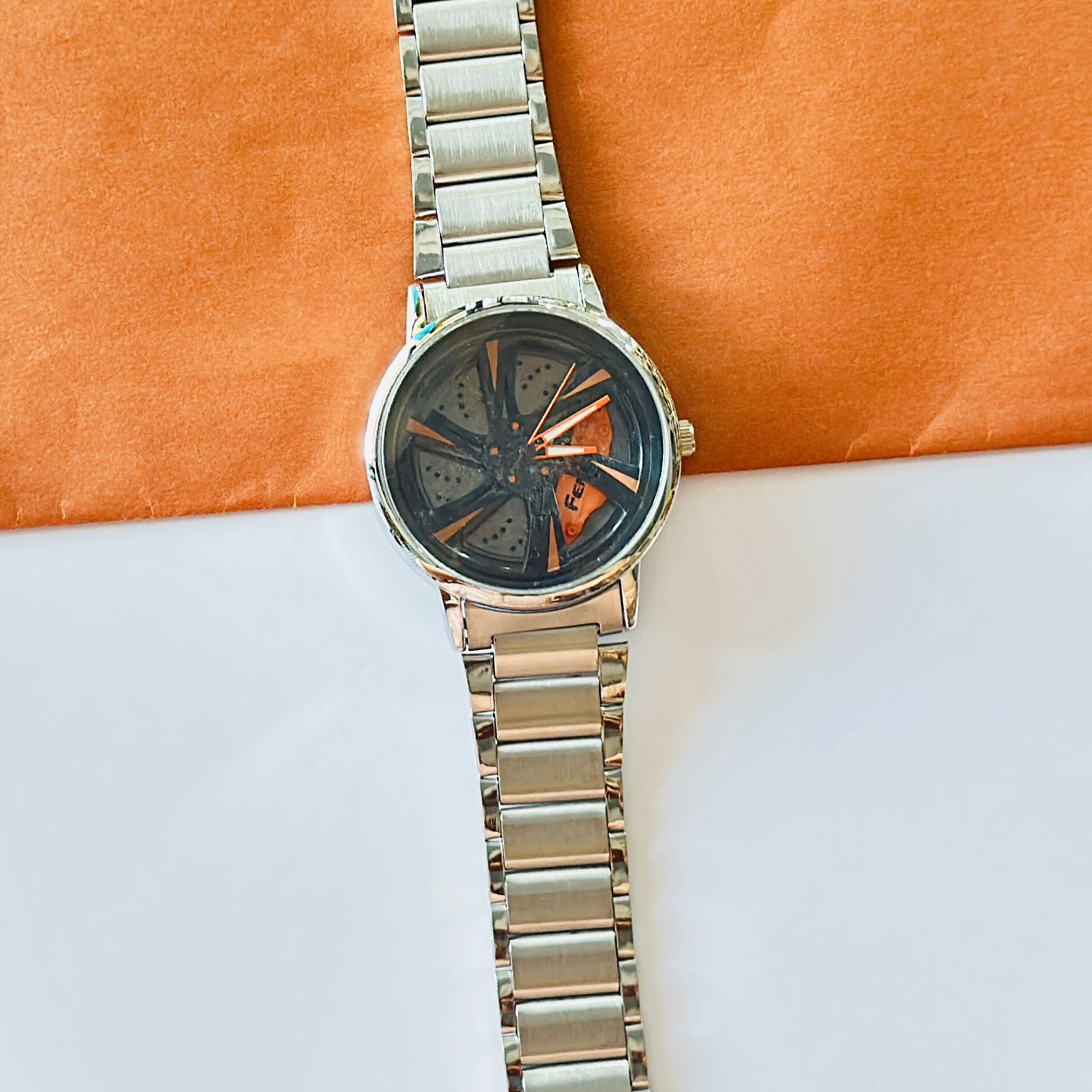 spinning car wheel rim-themed watch