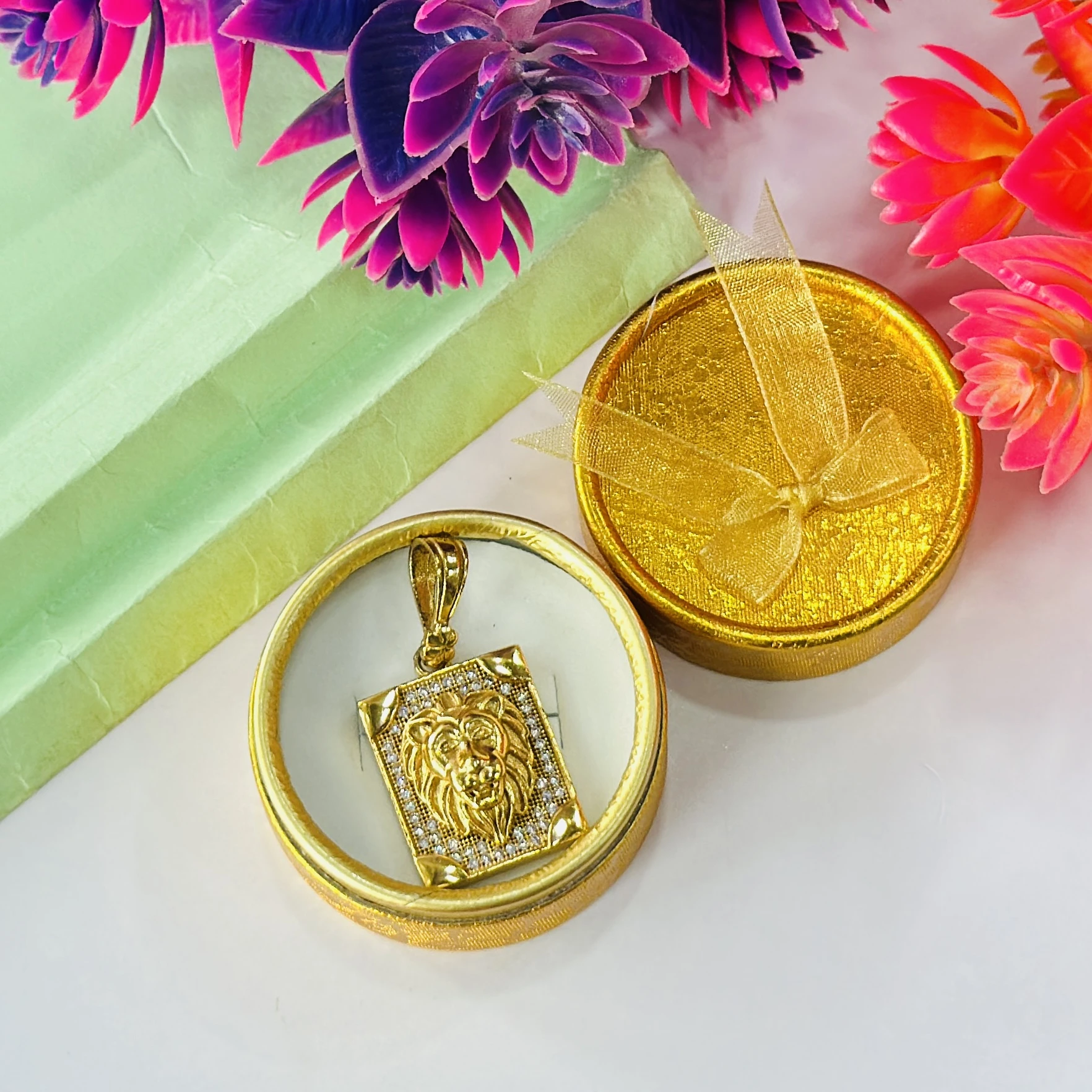 Gold plated lion face pendant