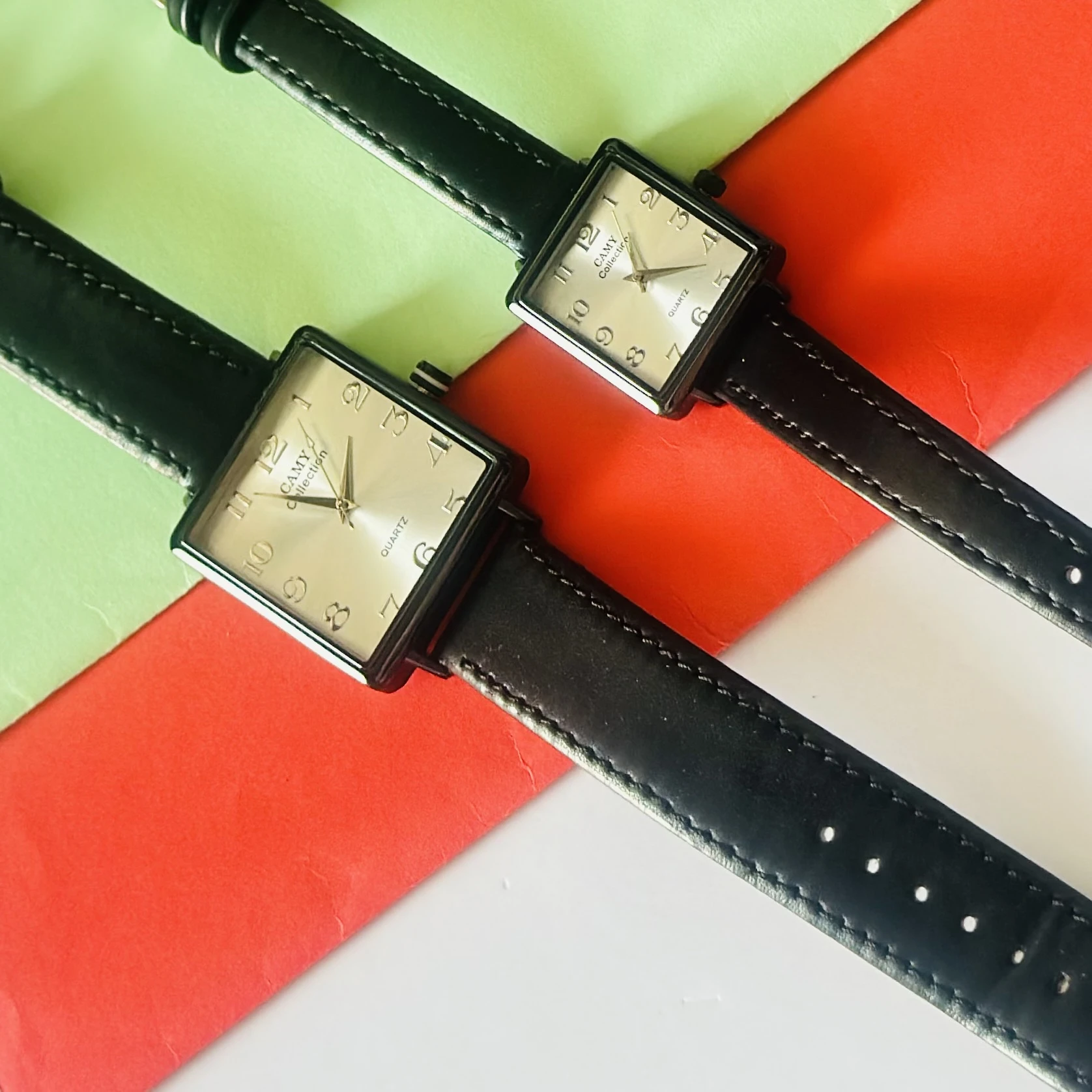 Camy Collection analog quartz watches with black leather straps and square dials.