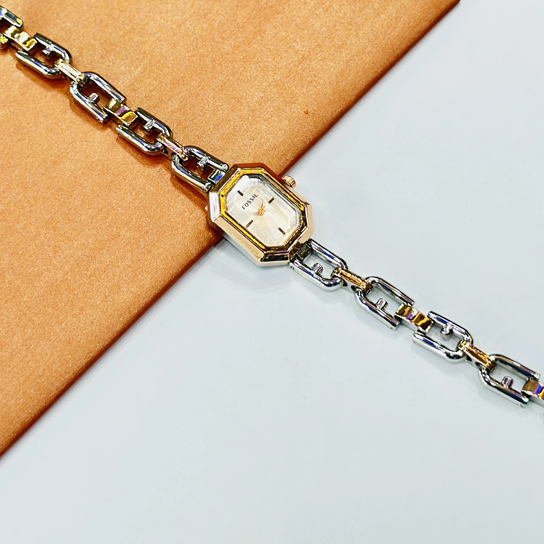 Fossil Harlow Mini two-hand rose gold-tone watches with chain bracelets.