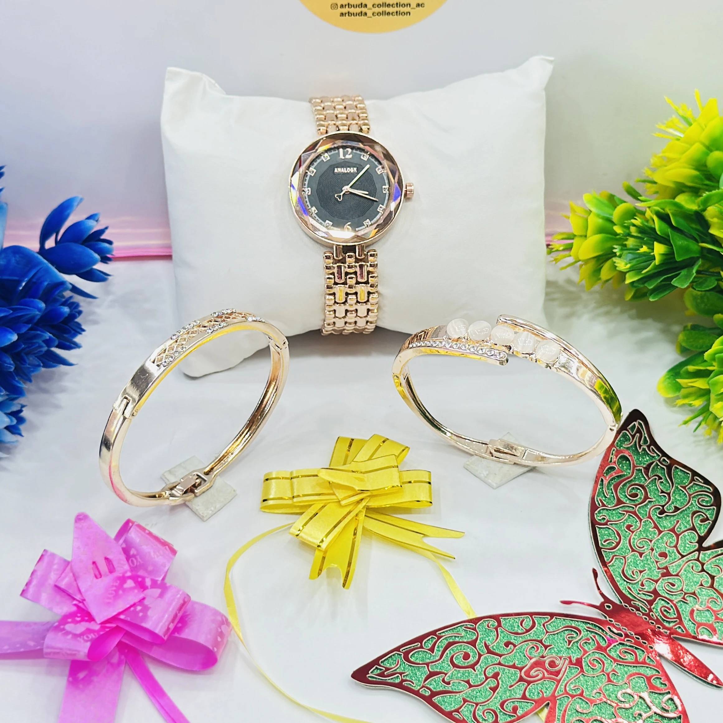 ladies' rose gold-tone Analogx brand watch set that includes matching bracelets.