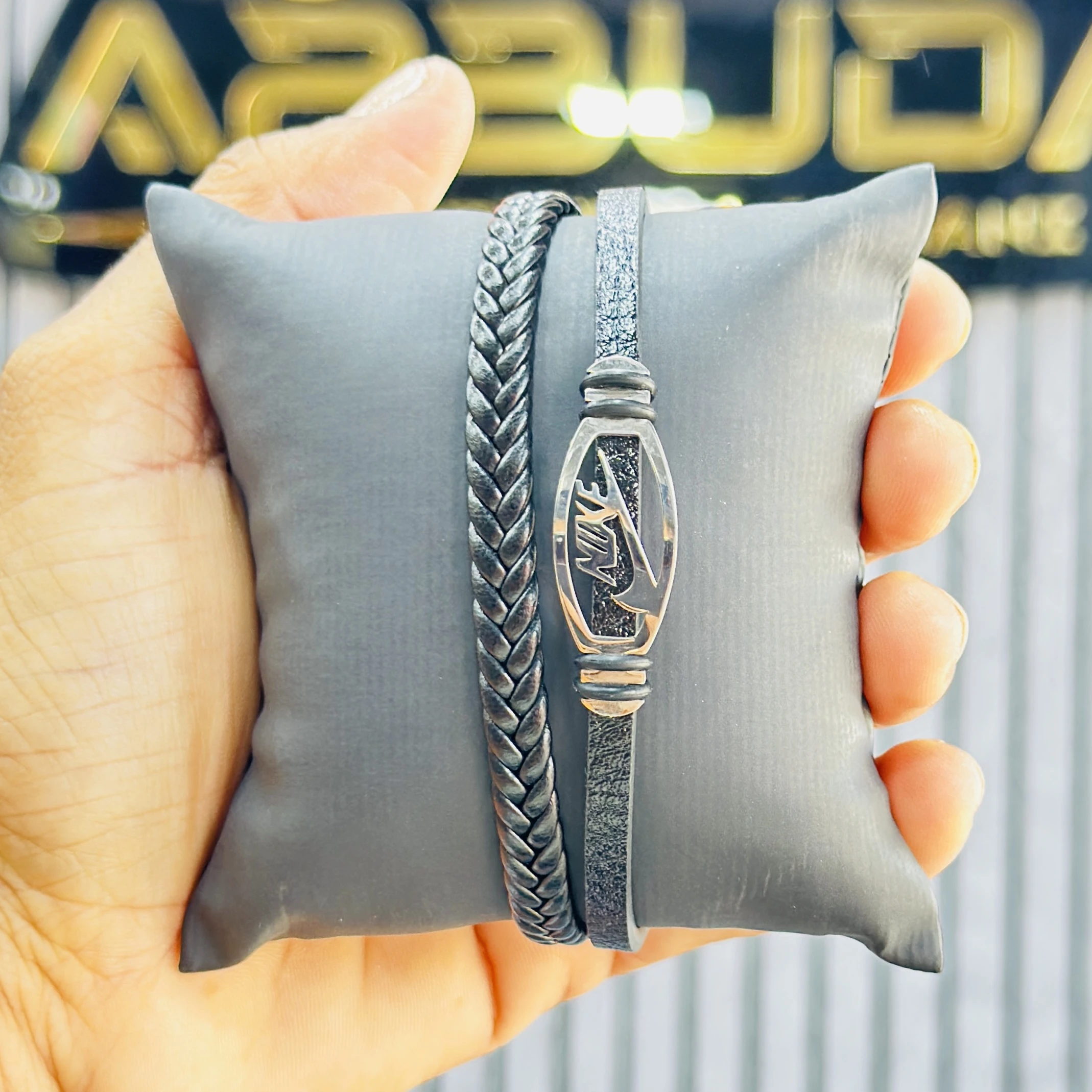 men's braided leather bracelet featuring a Nike branded metallic element.
