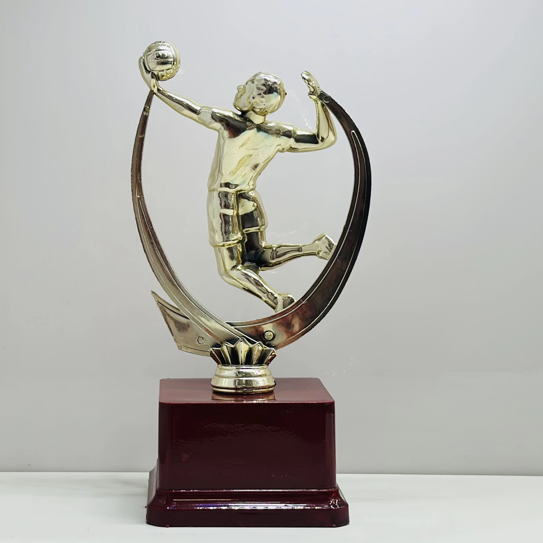 cricket trophy featuring a batsman figure.