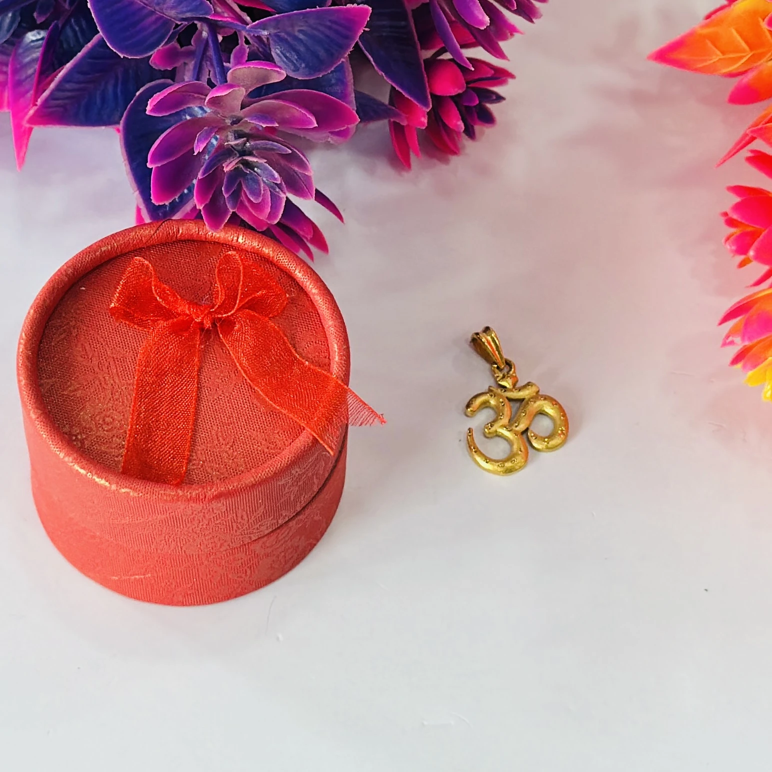 Gold plated Om pendant.