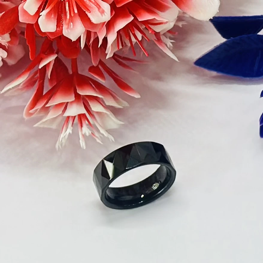 Black ceramic or stainless steel geometric/faceted band ring.