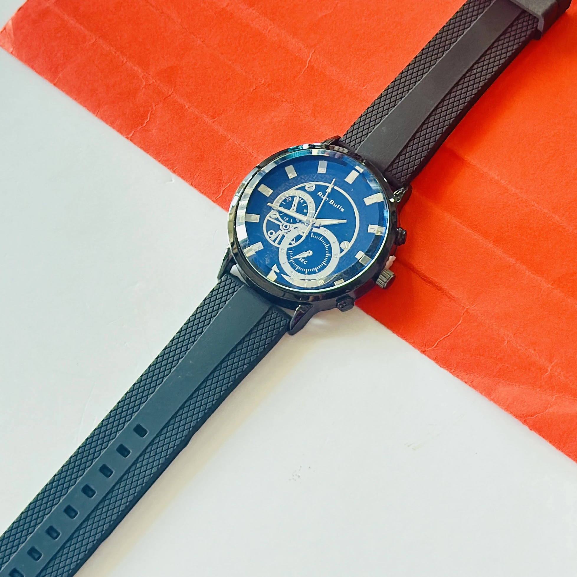 watch features a "Run Bulls" branded blue dial with a black silicone strap.