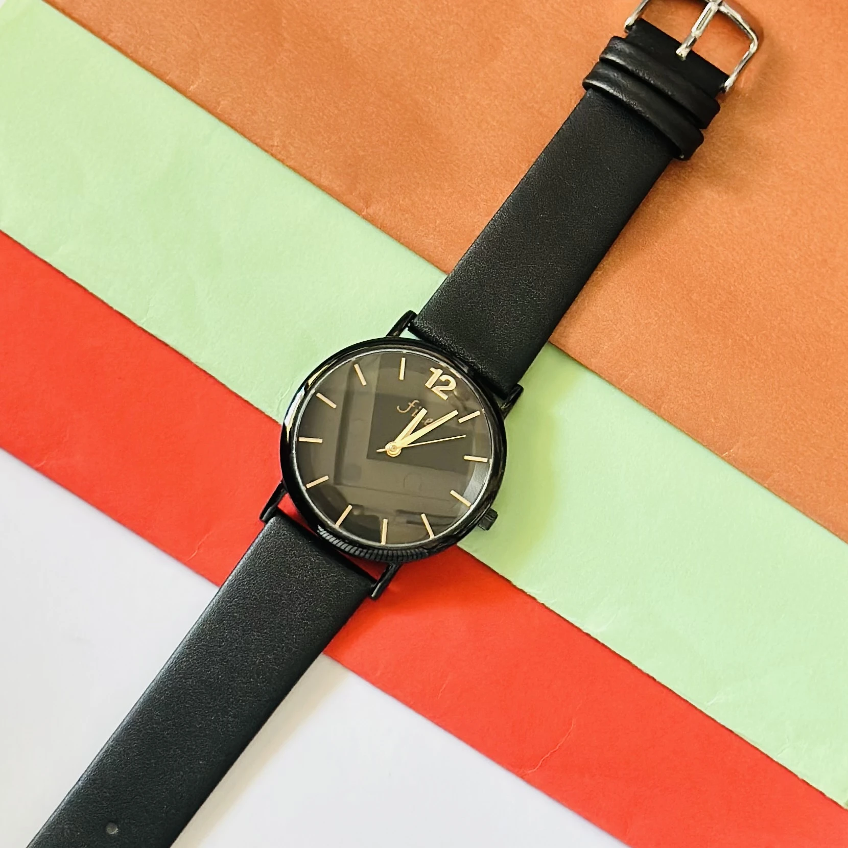 Witch Ines all-black faux leather strap watch for women.