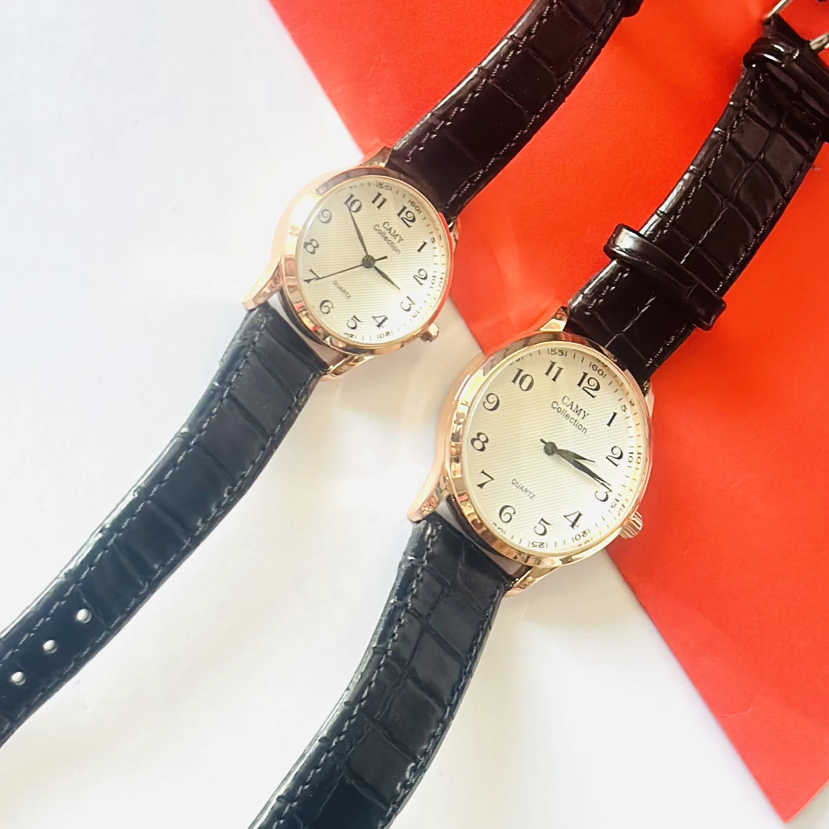 men's Camy Collection analog quartz watches with black leather straps and cream dials.