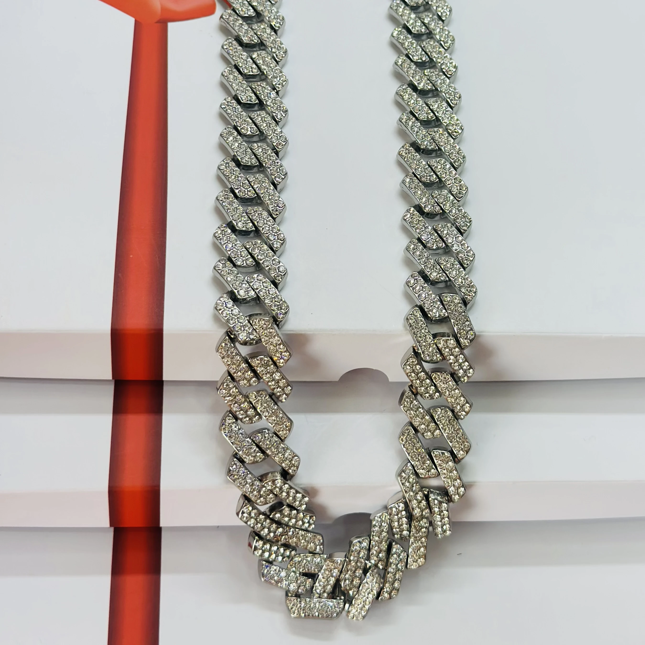 silver-plated stainless steel Cuban link chain with rhinestones.