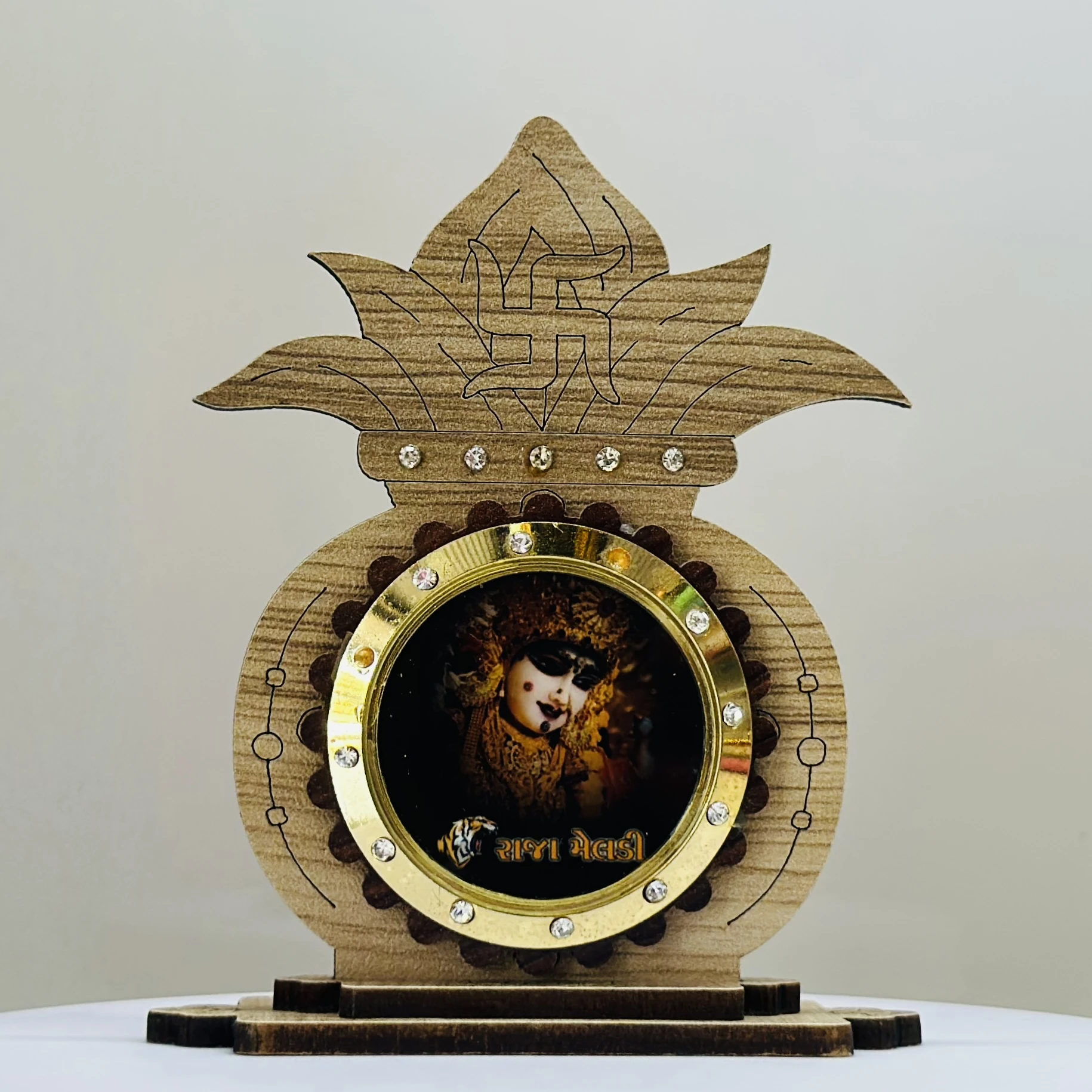 wooden showpiece featuring the Hindu deity Raja Meldi