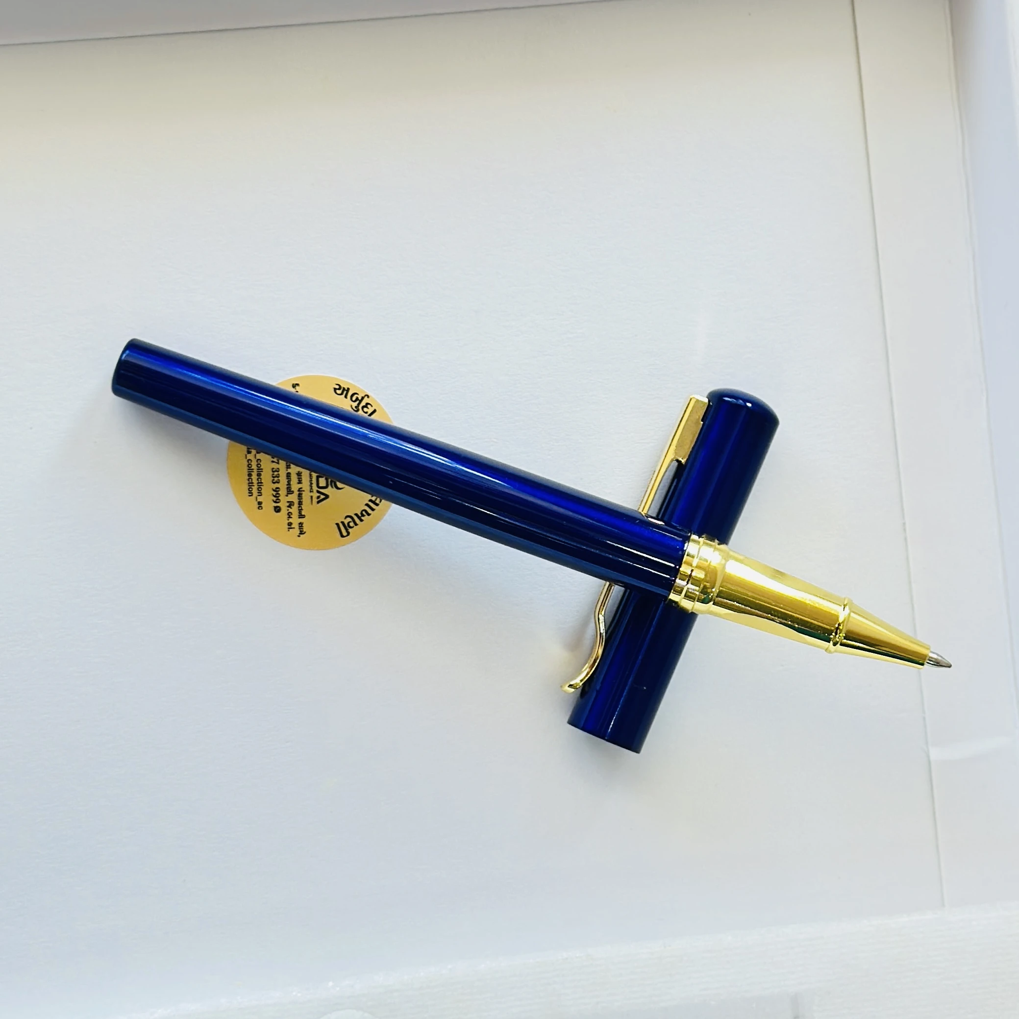 Blue metallic rollerball pen
