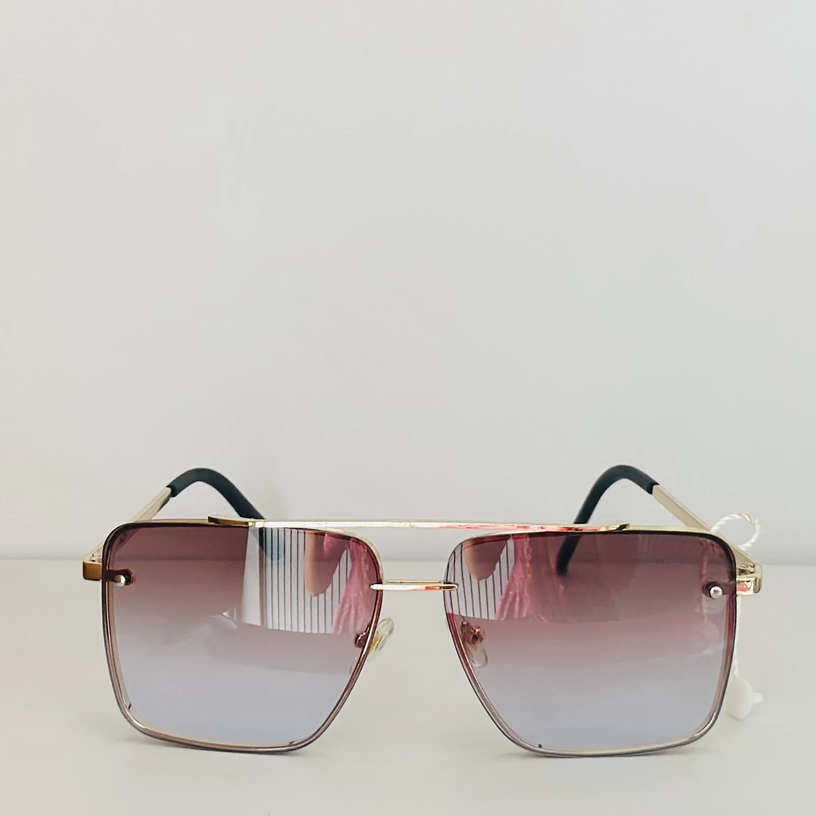 pair of DITA Mach-Six sunglasses with gold-tone frames and brown-to-clear gradient lenses