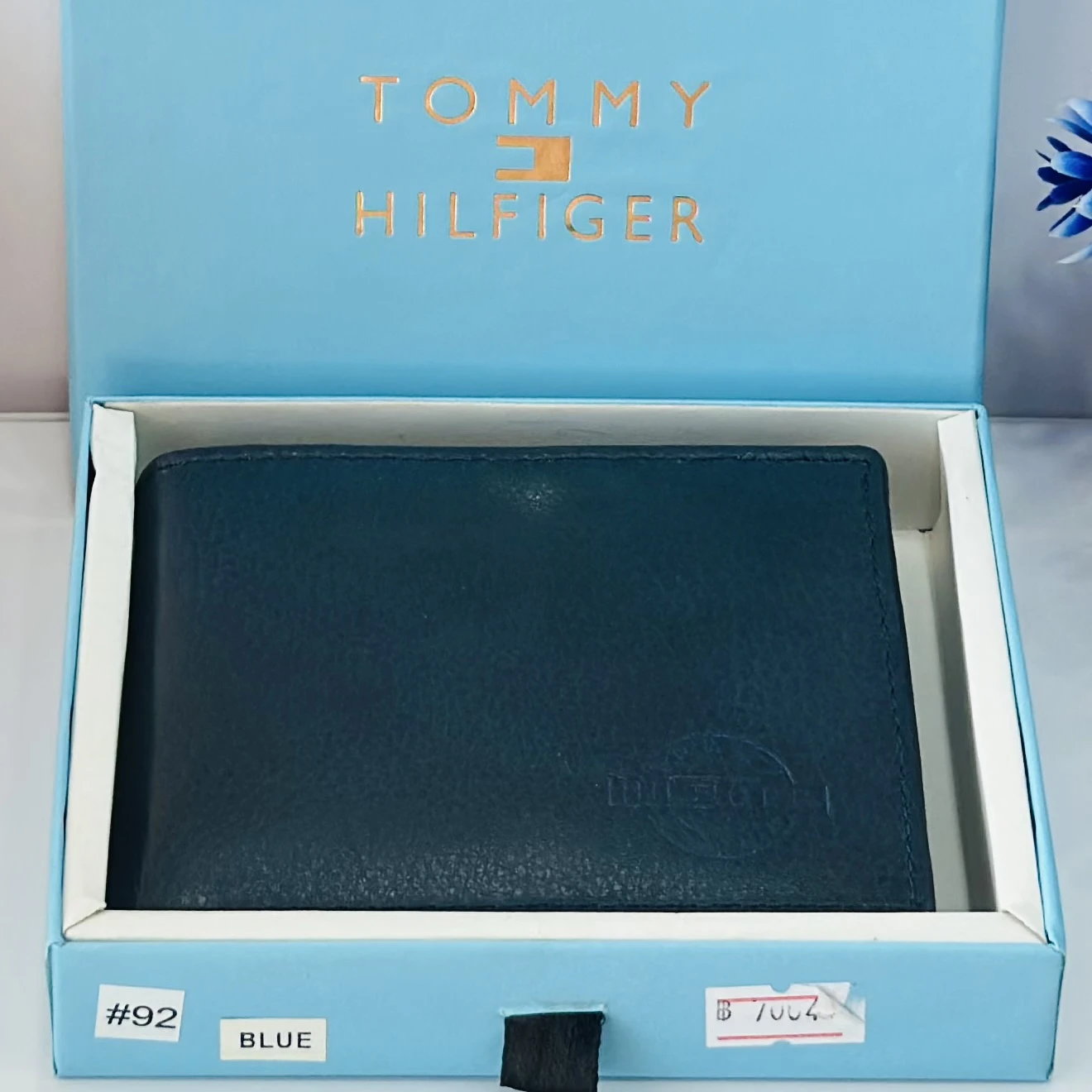 Blue Tommy Hilfiger men's genuine leather bi-fold wallet.