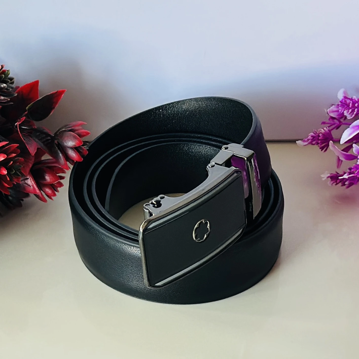 Black textured synthetic leather belt