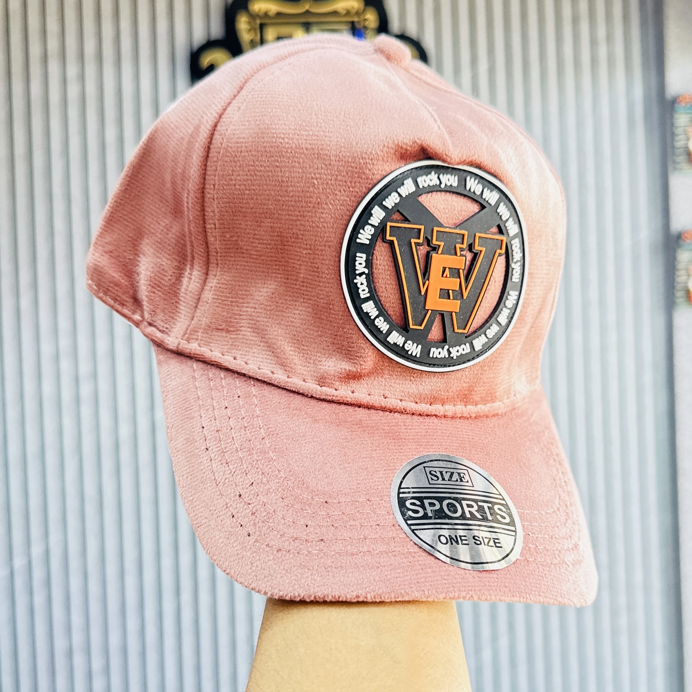 dusty rose-colored baseball cap