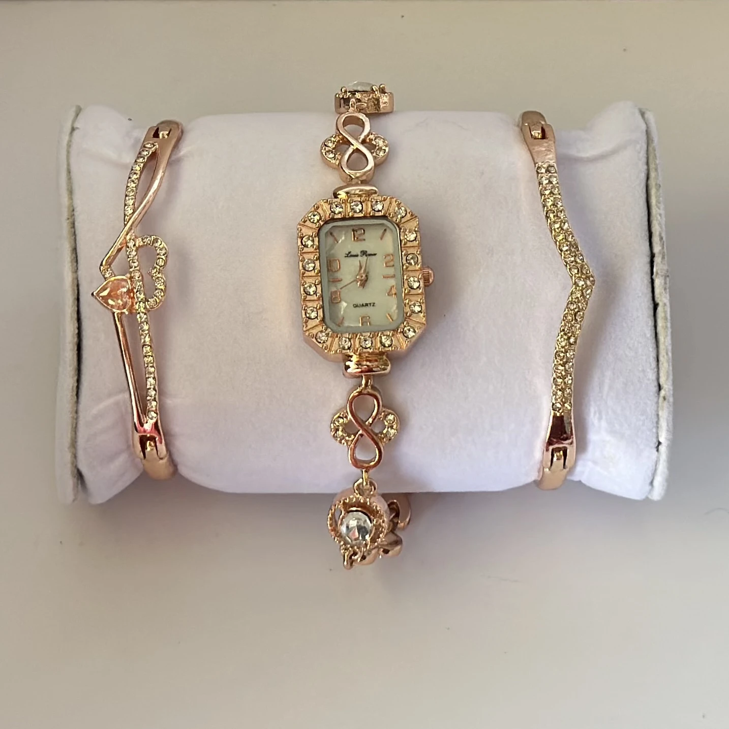 women's watch and bracelet set in rose gold color.
