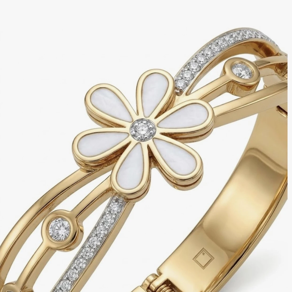 Gold tone hinged bangle bracelet