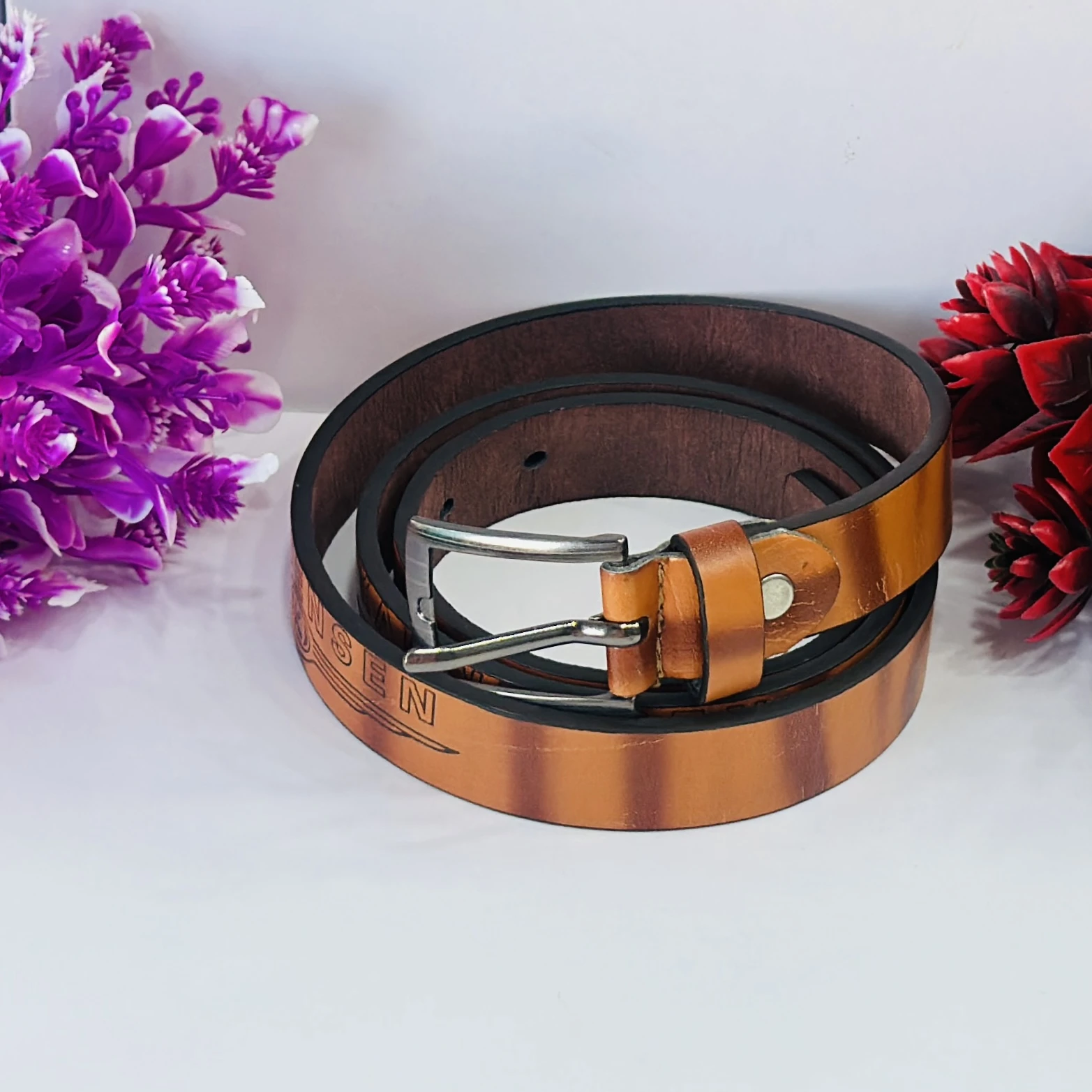 Roadster men's leather formal belt in a tan color.