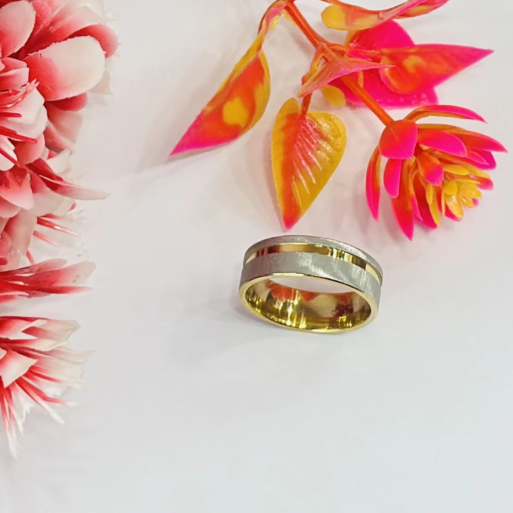 gold and silver-toned stainless steel dual-edge wedding band with a brushed finish