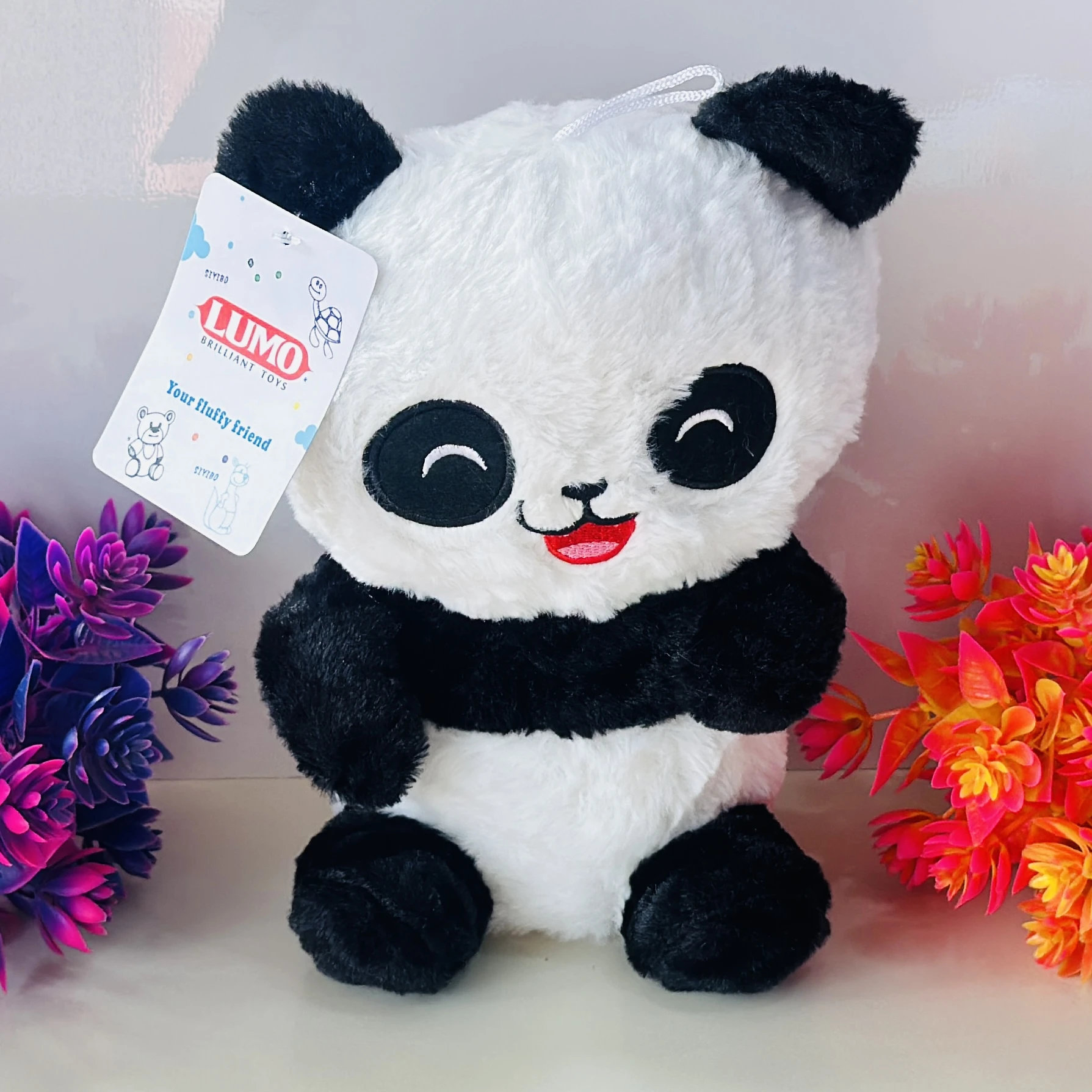 LUMO Brilliant Toys panda soft toy.