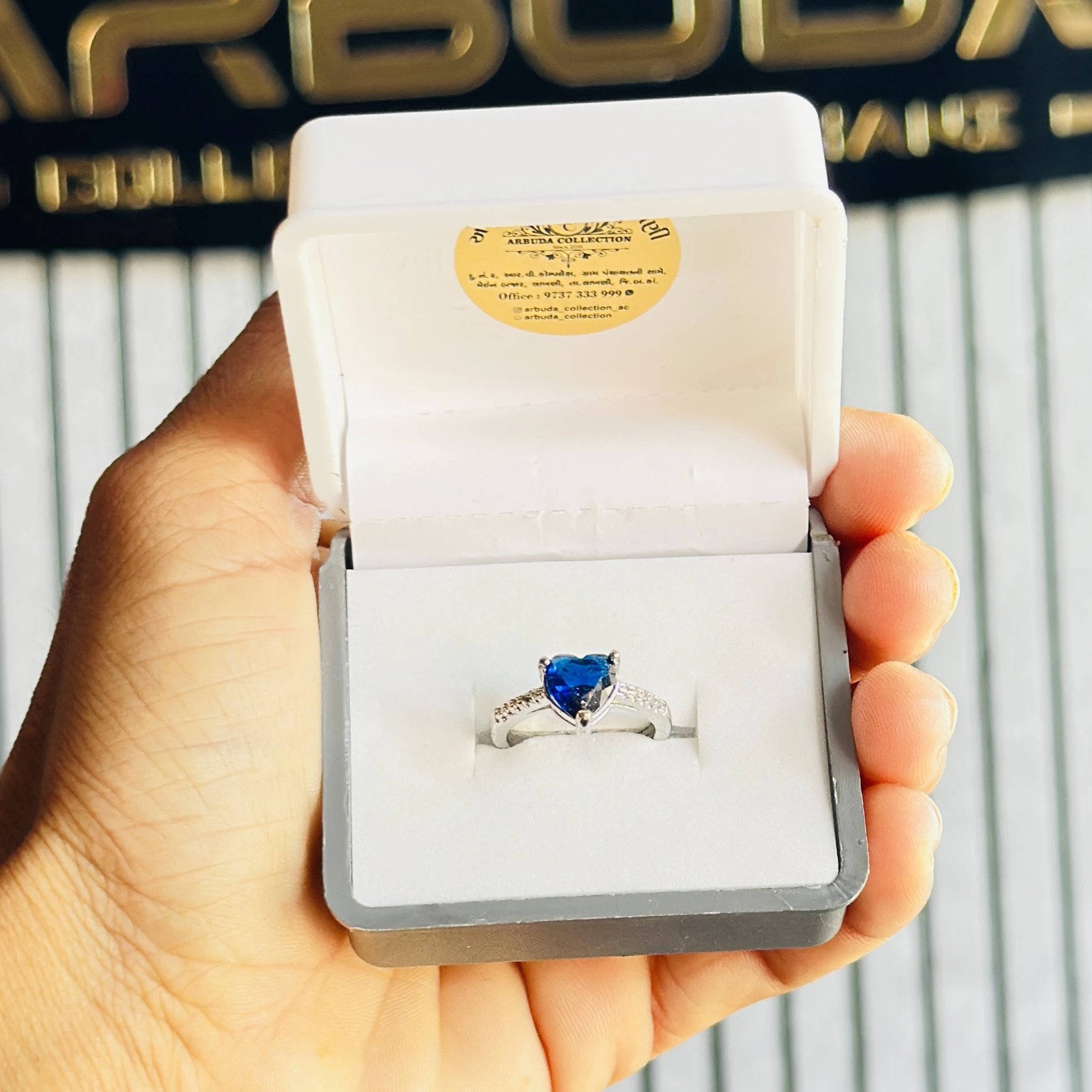 silver-plated ring featuring a heart-shaped blue artificial stone