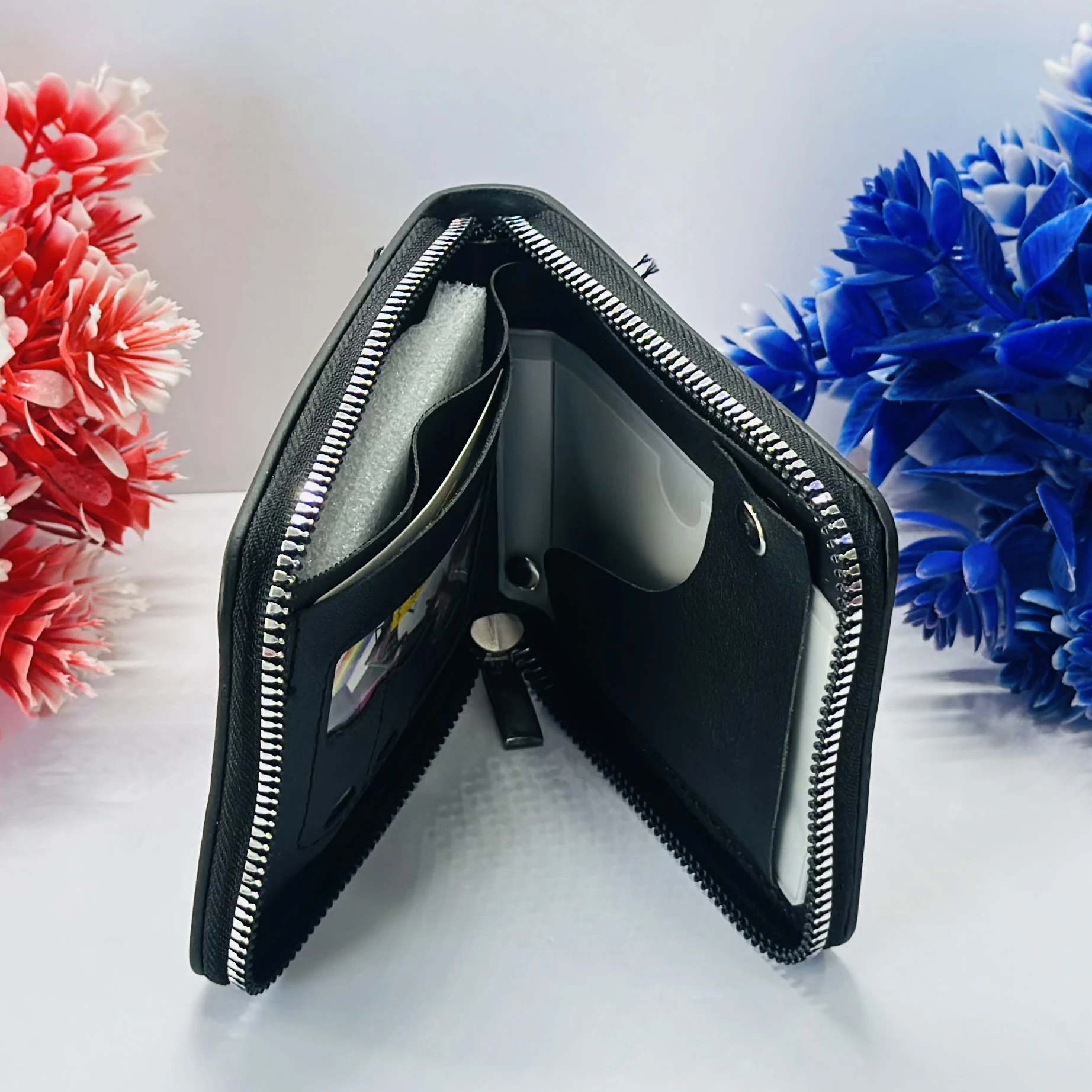 Black faux leather bi-fold wallet by Savfox.