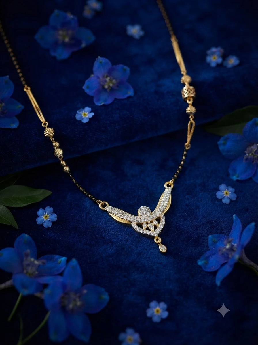 gold-plated mangalsutra features a delicate geometric pendant adorned with sparkling stones.
