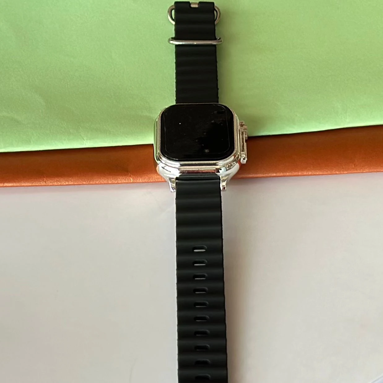 Black digital watch with a silicone strap
