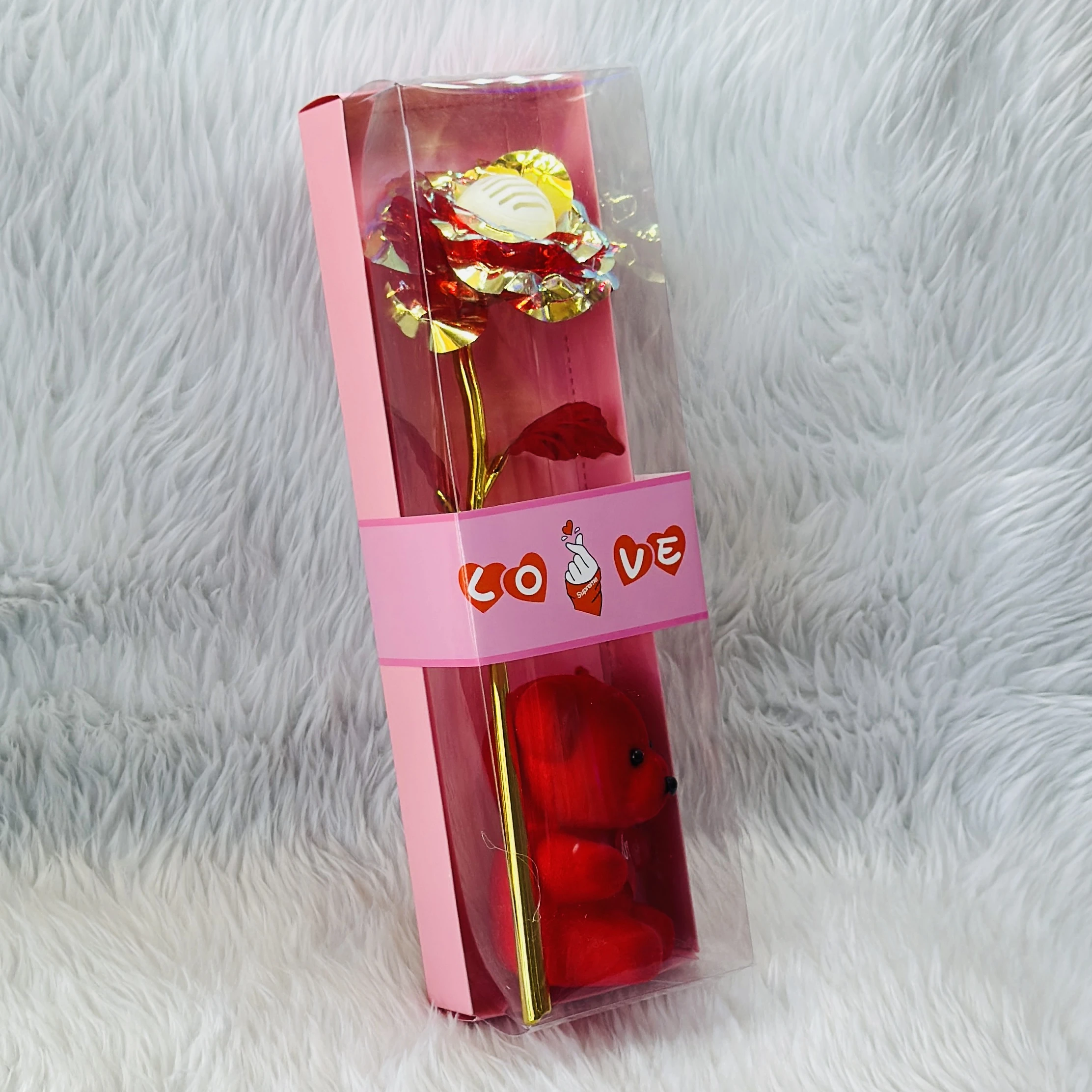 Gift set featuring an artificial golden rose and a red teddy bear, often marketed for Valentine's Day.
